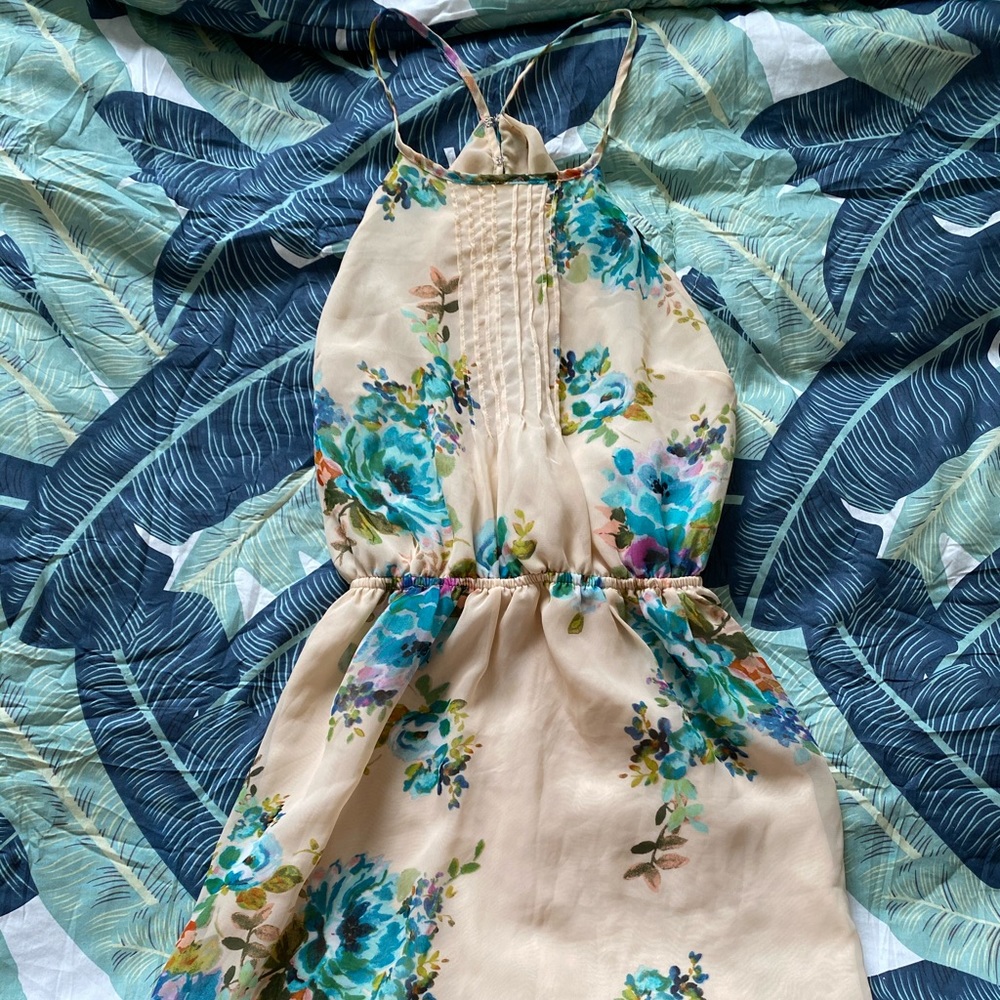 Floral halter dress with peek a boo back slit